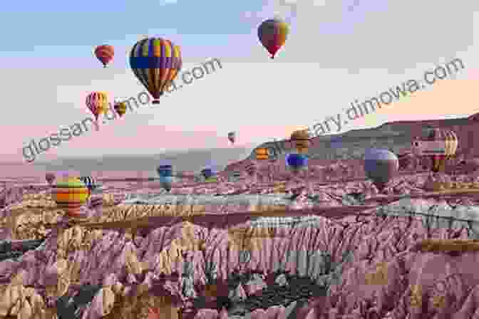 Hot Air Balloons Floating Over The Surreal Landscape Of Cappadocia Being A Tourist In Turkey